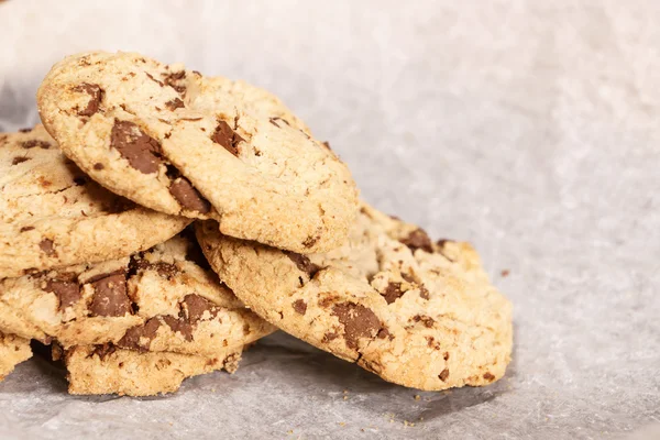 Stacked round soft bake chocolate chip cookie close up