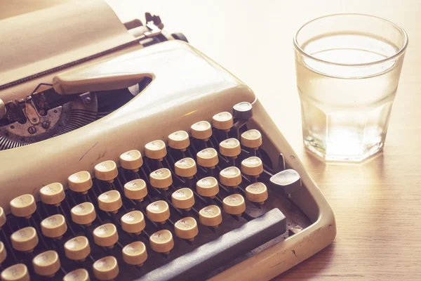 Vintage typewriter on wooden desk