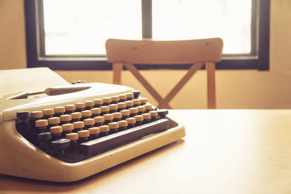 Vintage typewriter on wooden desk