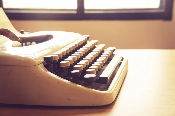 Vintage typewriter on wooden desk