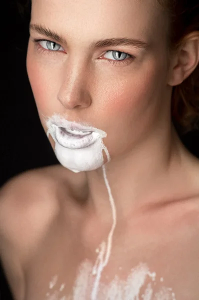 Girl with milk on face