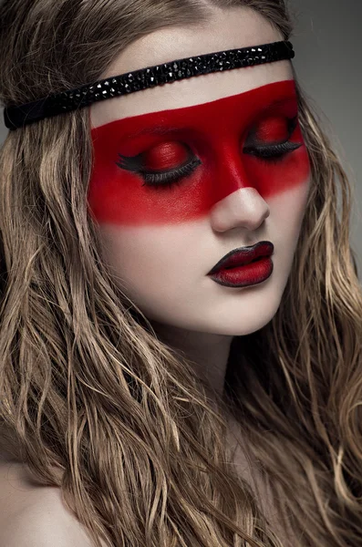 Woman with red art make-up