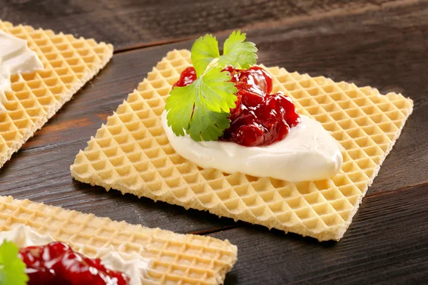 Yellow waffle with cottage cheese and jam