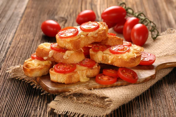 Grilled toast with cheese and tomatoes