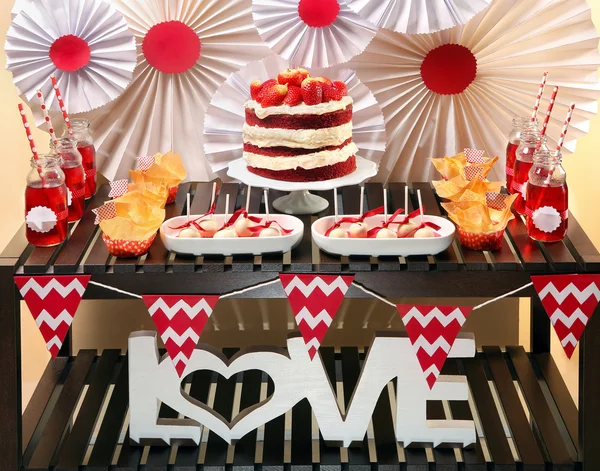 Valentine\'s Day party table with red velvet cake