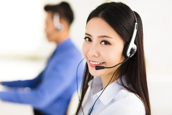 Beautiful call center agent working in office