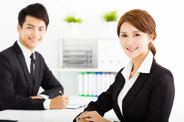 Happy business man and woman working  in office