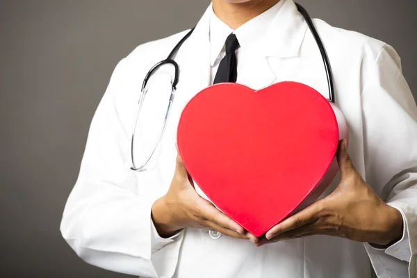 Closeup of medical doctor hands with heart