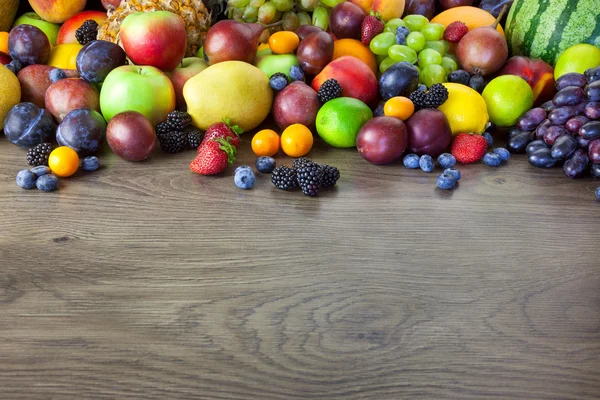 Big assortment of Fresh Organic Fruits, border composition