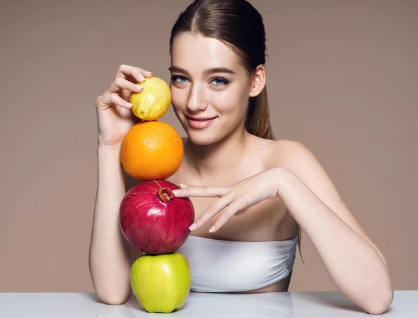 Lovely girl with fruits mix, natural organic raw fresh food concept