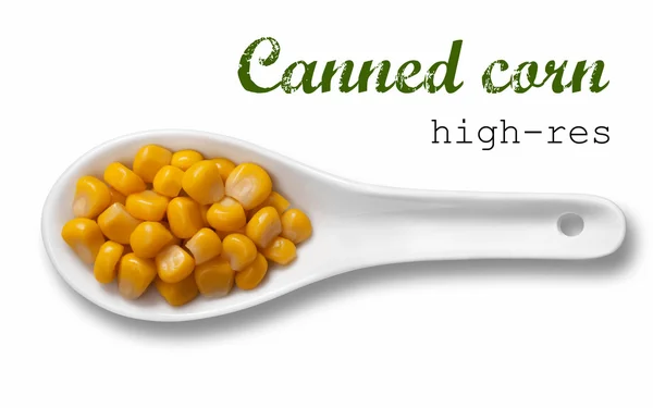 Canned corn in white porcelain spoon