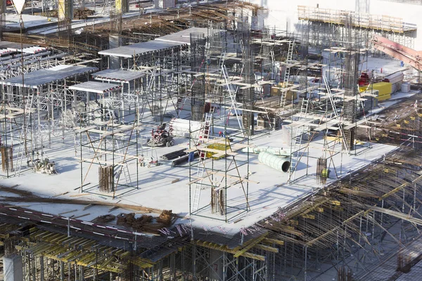 Building construction site with workers in Dubai