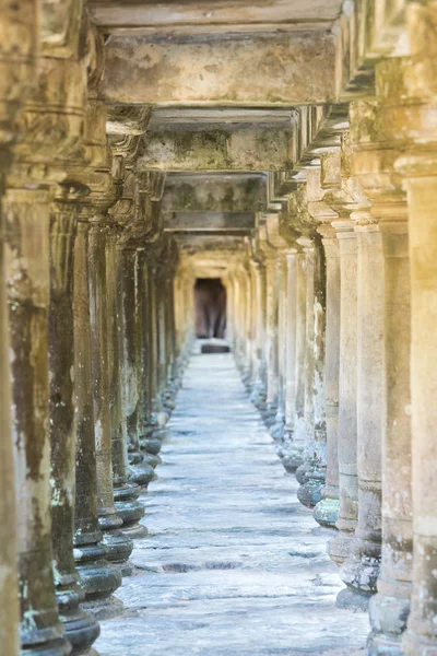 Aisle with columns in the ancient temple of Bayon Temple, Cambod