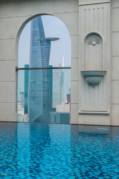 Pool on top of building with Saigon aerial view, Vietnam