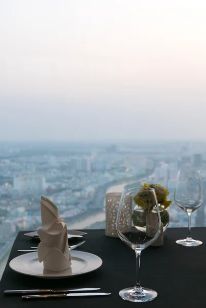 Details of elegant indoor restaurant table with city View. Ho Ch