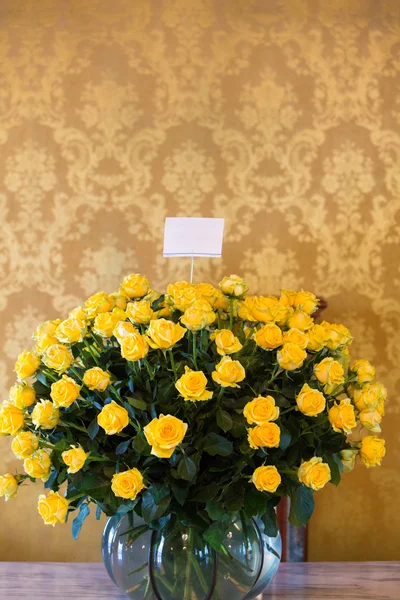 Set of yellow roses arranged in a stone vase. Quito