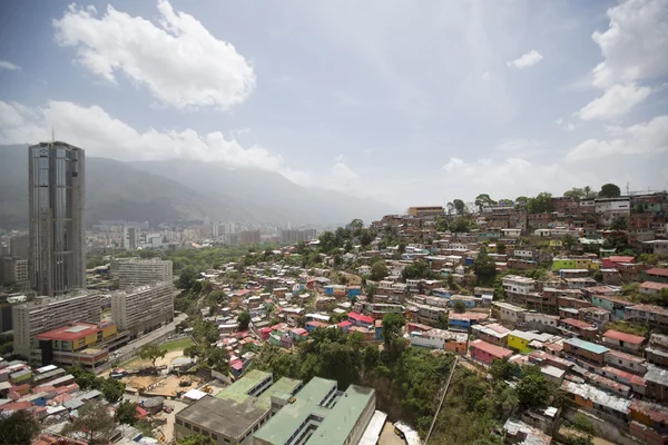 Slum district of Caracas with small wooden coloured houses