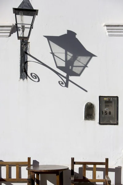Colonial architecture in Cachi and shadow of antique street ligh
