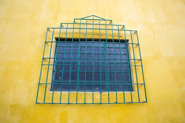 Colored wall and window, colonial architecture in Cali