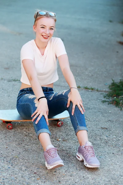 Young woman with skateboard