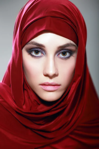 Arabic woman wearing red scarf