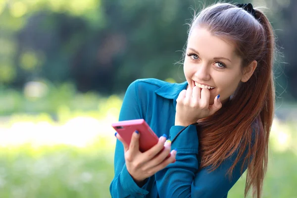 Caucasian woman laughing at phone