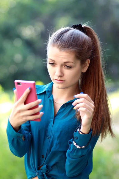 Girl looking at phone seeing bad news