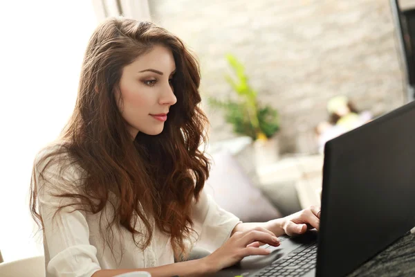 Woman chatting on laptop