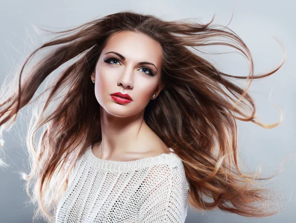 Brunette girl with fluttering hair