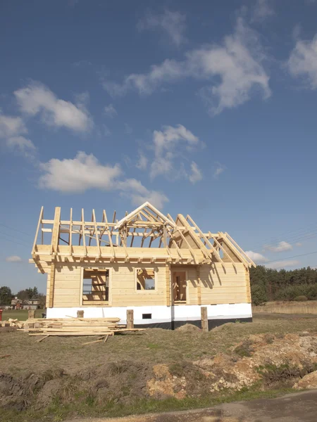 Construction of a wooden house with logs rectangular