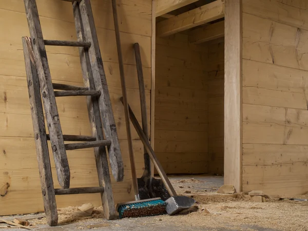 Big hammer, broken wooden ladder, shovel and brush