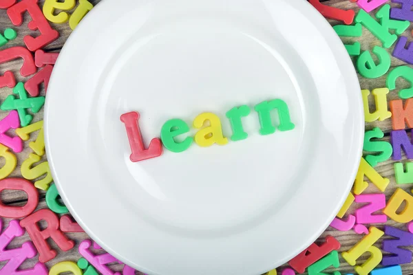 Learn word on white plate