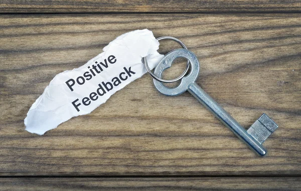 Key with message Positive Feedback