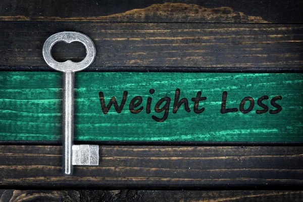 Weight Loss word and old key