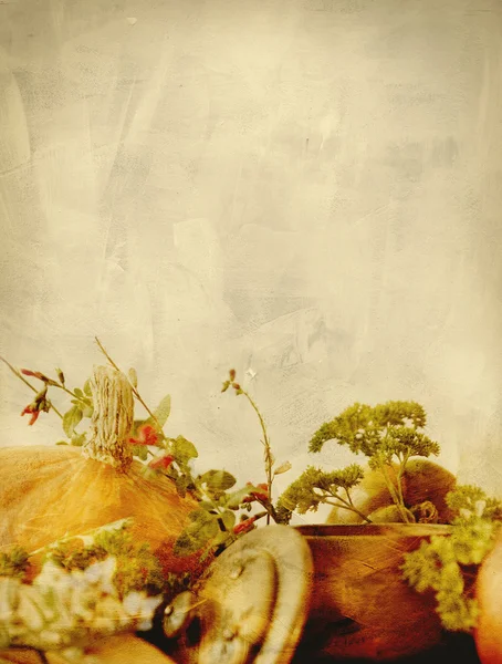 Background texture with pumpkins, carrots, seeds, butternut squash and herbs - Still life composition with seasonal vegetables of autumn