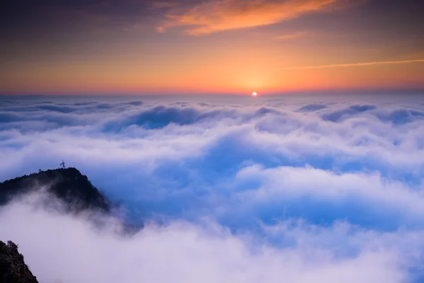 Sunrise in the sea of clouds