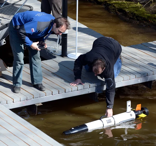 The marine scientists launch an Autonomous underwater unmanned vehicles.