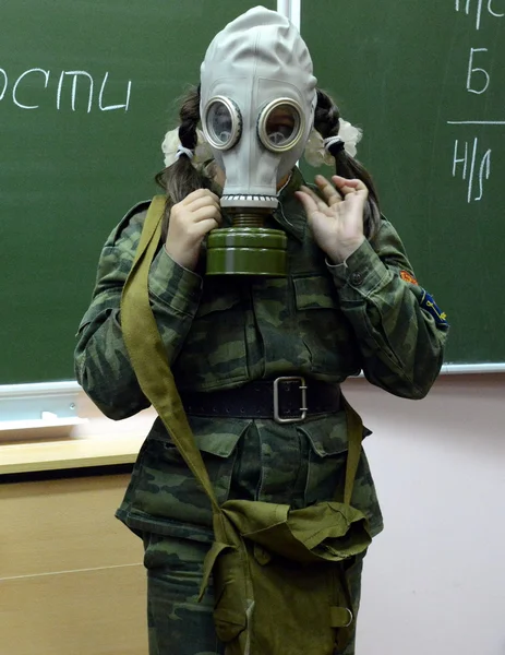 Training putting on the gas mask in the cadet corps of the police.