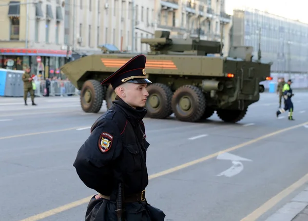 The police provide law and order during the rehearsal of the military parade on Tverskaya street in Moscow.