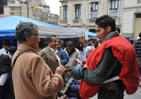 Students of medical faculty give classes to people on the street on healthy life style.