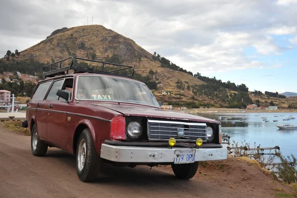 The car on the shores of lake Titicaca in the town of Copacabana