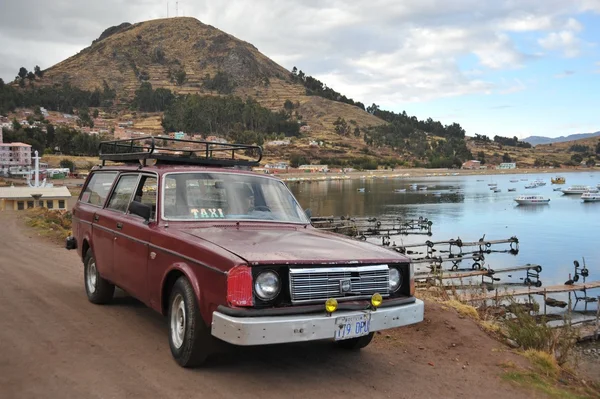 The car on the shores of lake Titicaca in the town of Copacabana.