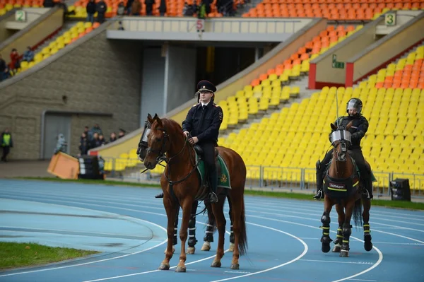 Mounted police patrol at the Moscow stadium.