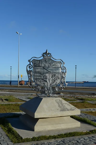 The coat of arms of the city of Punta arenas on the waterfront.