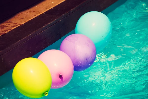 Balloons in water