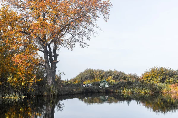 Calm lake with autumn trees