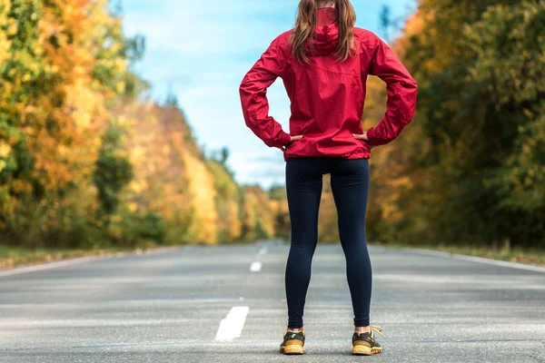 Lady in a track suit standing