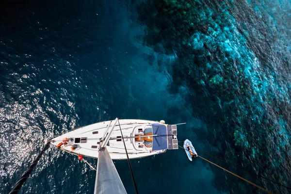 Sailing boat near the coral reef