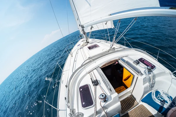 Sailing boat moves in the sea