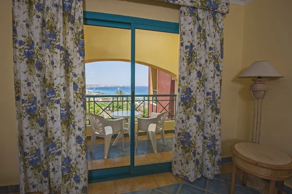 Interior of a luxury hotel room with balcony